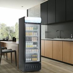 an image of a refrigerator in the middle of a kitchen with lots of bottles on it