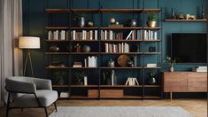 a living room filled with furniture and a flat screen tv sitting on top of a wooden shelf