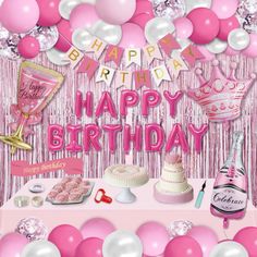 a pink birthday party with balloons, cake and confetti