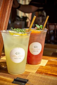 two drinks sitting next to each other on a table