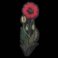 a red flower with green leaves on a black background in the shape of a sticker