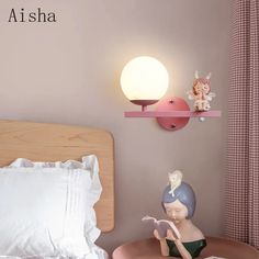 a bedroom with pink walls and white bedding, two small figurines on the nightstands