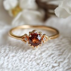 garnet ring Unique Simple Rings, Amber Engagement Rings, Red Engagement Ring Unique, Engagement Ring Without Diamond, Brown Gemstone Ring, Earthy Rings Engagement, Gold Engagement Ring Colored Stone, Amber Wedding Ring, Unique Wedding Ring Stack