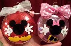 two christmas ornaments with minnie mouse faces on them