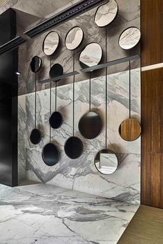 a kitchen with marble counter tops and hanging plates on the wall