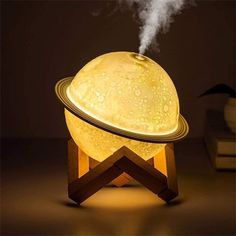 an image of a lamp that has steam coming out of it and is sitting on a table