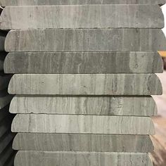 several pieces of grey marble stacked on top of each other