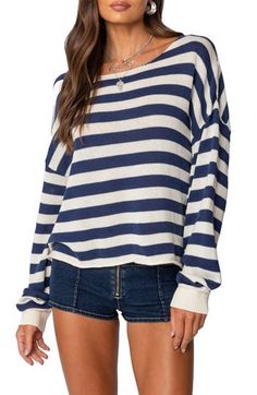 Lightweight  and relaxed, this sweater ringed in bold stripes sports a dramatically oversized fit that slouches like an old favorite. Boat neck Long sleeves with ribbed cuffs 90% cotton, 10% polyester Machine wash, dry flat Imported Striped Knitwear, Oversized Striped Sweater, Winter Knit Sweater, Sweater Oversized, Sweater Oversize, Thanksgiving Outfit, Casual Stripes, Striped Sweater, Shoulder Sweater