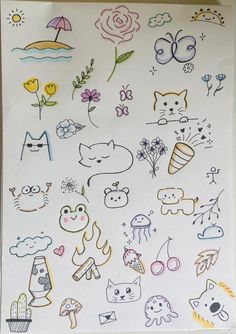 a sheet of paper that has various stickers on it, including cats and flowers