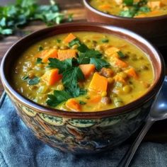 two bowls filled with soup on top of a table