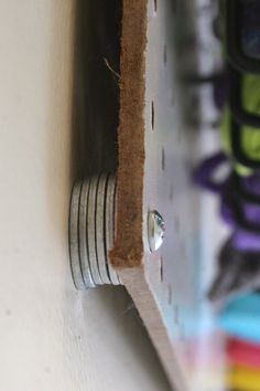 a close up of a metal object on a wall