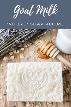 goat milk soap bar on a wooden table with lavender and honey in the background text reads goat milk no lye soap recipe