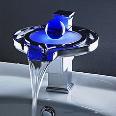 a faucet that is sitting on top of a sink with water running from it