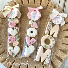 decorated cookies in the shape of letters and flowers