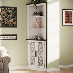 a living room scene with focus on the corner cabinet