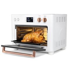 a chicken is cooking in an oven with the door open and it's light on