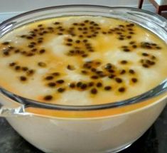 a glass bowl filled with pudding on top of a table