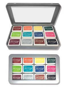 an open tin of assorted colored inks in it's case on a white background