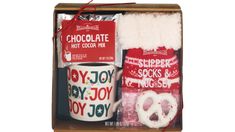 a hot chocolate gift set in a wooden box with a mug and other holiday treats