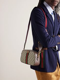 Gucci's 'Ophidia' bags have been a brand signature since they first debuted in 2018. Perfectly sized to fit your everyday essentials, this version has been crafted in Italy from monogrammed coated-canvas and detailed with striped webbing, leather trims and gold-tone 'GG' hardware. Messenger Bag For Men, Gucci Collection, Gucci Ophidia, Canvas Messenger Bag, Messenger Bag Men, Brown Coat, Gucci Accessories, Everyday Essentials, Mr Porter