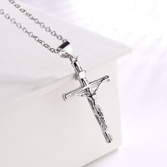 This necklace is a beautiful reminder of your faith. Made with 14K gold and sterling silver, this crucifix cross pendant necklace features Jesus on the front. You can wear this to any special occasion or just on your daily life. This will make you stand out in the crowd. The necklace has a crucifix medal charm with a beautiful chain design, which is very eye-catching and many people will notice you wearing this necklace when they see you on the road or in public places. The 14K gold-plated sterl Cross Accessories, Public Places, Holy Cross, Make A Gift, Sterling Silver Cross, Cross Pendant Necklace, Silver Cross, Gold Pendant Necklace, Christian Gifts