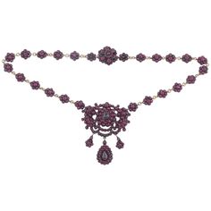 Victorian bohemian garnet necklace. This piece is set in silver gilt with pretty garnet flowers and smaller drop flowers. Circa 1870-80, Measures: 42cm long and the central drop measures 6cm Drop Necklaces, Silver Gold Necklace, Silver Drop Necklace, Jewelry Victorian, Victorian Necklace, Garnet And Gold, Snake Necklace, Garnet Necklace, Victorian Gold