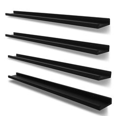 three black shelves are lined up against the wall