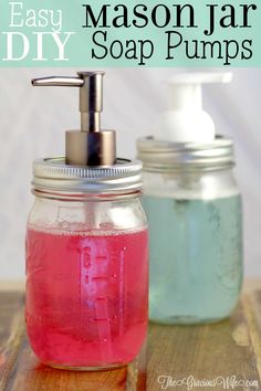 mason jar soap pumps with pink liquid in them on a wooden surface and text overlay that reads easy diy mason jar soap pumps