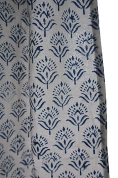 the blue and white fabric has small flowers on it