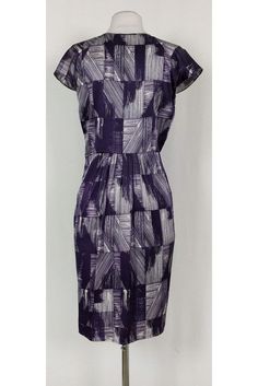 This pretty dress has a fun abstract print in a chic purple and white color. Cap sleeves, a plunging neckline and pleats along the waist all elevate this basic dress from Poleci. It can be dressed up or down for any occasion. Size 4 91% silk, 9% lycra V-neck Cap sleeves Side zipper Unlined Abstract print Bust 34.5" Waist 30" Shoulder to hem 39" Purple Lined Midi Length Dresses, Elegant Blue Dress With Abstract Print, Elegant Sheath Printed Dresses, Elegant Printed Sheath Dress, Elegant Fitted Pleated Dress With Floral Print, Fitted Purple Printed Dress, Fitted Purple Printed Midi Dress, Elegant Fitted Dress With Abstract Print, Chic A-line Dress With Abstract Print