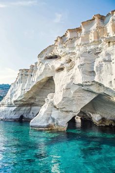 the water is crystal blue and clear, with white cliffs in the backgroud