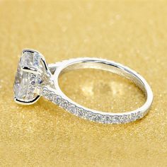 a diamond ring on a gold background