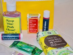 various personal care items are displayed on a white tablecloth with yellow and green accents