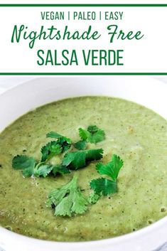 a white bowl filled with salsa and garnished with cilantro