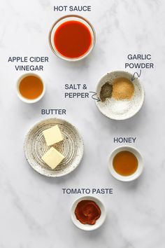 ingredients to make apple cider vinegar recipe laid out on a white marble countertop