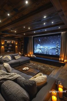 a living room filled with furniture and a flat screen tv sitting on top of a wooden wall