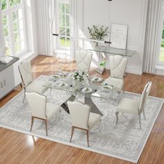 a dining room table with white chairs and an area rug