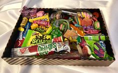 an open box filled with candy and candies