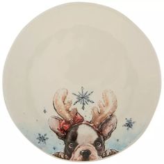 a plate with a dog wearing reindeer antlers on it