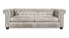 a grey couch with buttons on it