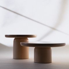 two wooden tables sitting next to each other