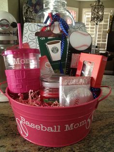 a pink bucket filled with personal items on top of a counter