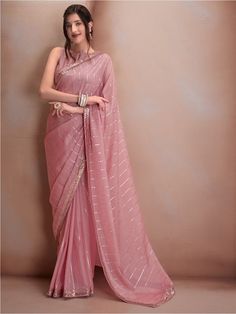 Pink and silver-toned sareeStriped embroidered saree with embroidered border borderHas sequinned detailThe saree comes with an unstitched blouse pieceThe blouse worn by the model might be for modelling purpose only. Check the image of the blouse piece to understand how the actual blouse piece looks like. Light Pink Saree Look Traditional, Georgette Designer Sarees, Onion Pink Saree Combination, Baby Pink Saree Look, Pink Saree For Farewell, Blouse Ideas For Organza Sarees, Pink And Silver Saree, Pink Saree Outfit, Blouse Designs For Organza Sarees