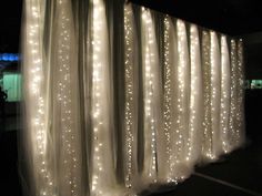 the curtain is covered with white lights