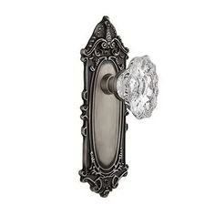 an antique style door handle with crystal glass knob