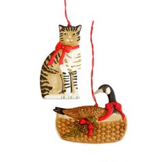 an ornament with a cat and a duck on it