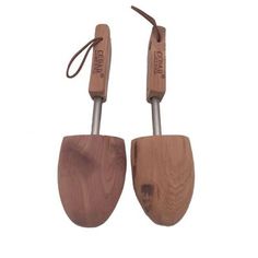 two wooden utensils with metal handles