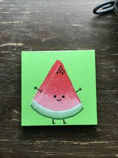 a piece of paper with a watermelon painted on it