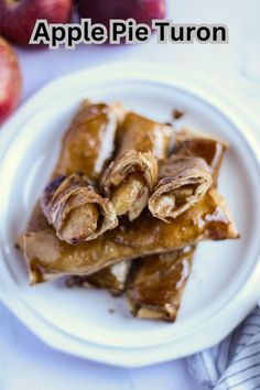 apple pieturon on a white plate with apples in the background and text overlay