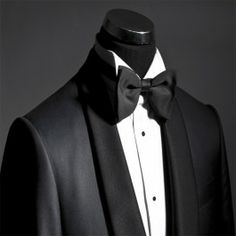 a black tuxedo with a white shirt and bow tie